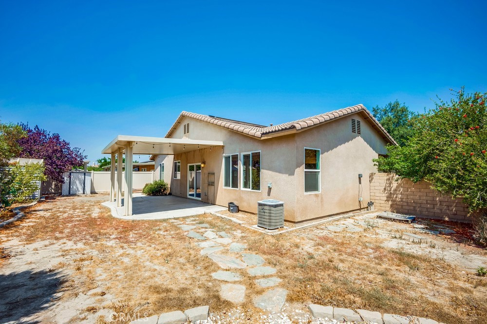 33409 Mesolite Way Menifee, CA 92584 - Photo 18 of 18 a view of a house with a patio