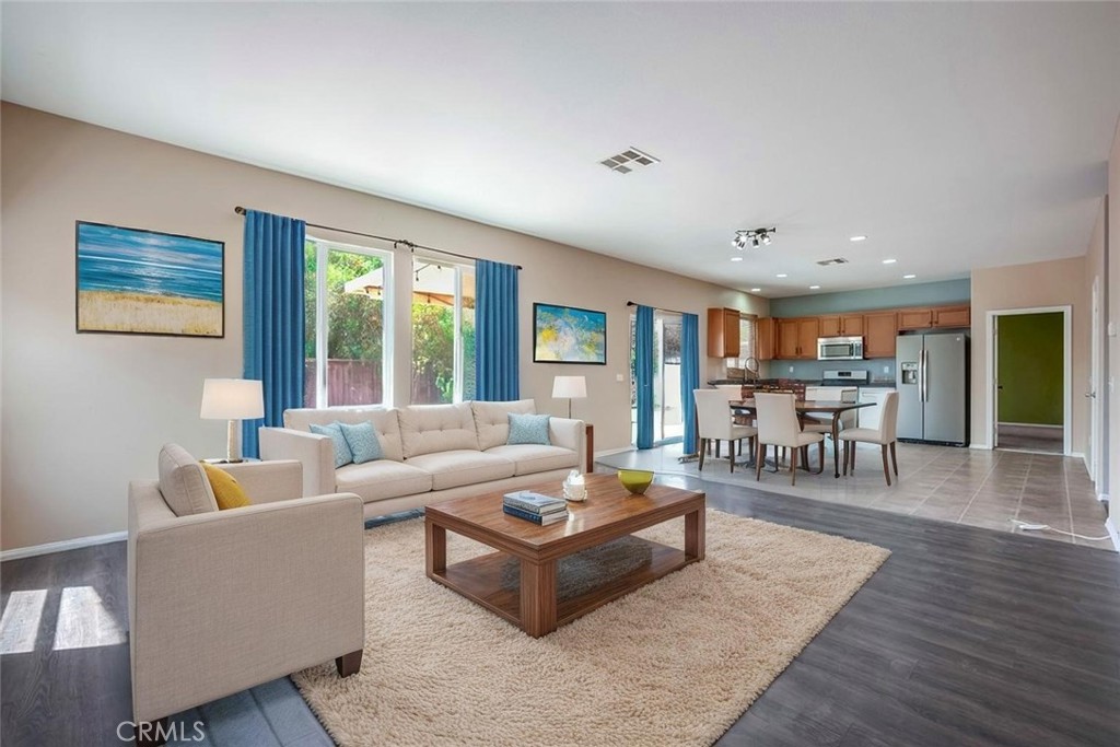 33409 Mesolite Way Menifee, CA 92584 - Photo 3 of 18 a living room with furniture and wooden floor