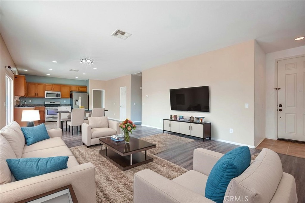 33409 Mesolite Way Menifee, CA 92584 - Photo 4 of 18 a living room with furniture and a flat screen tv