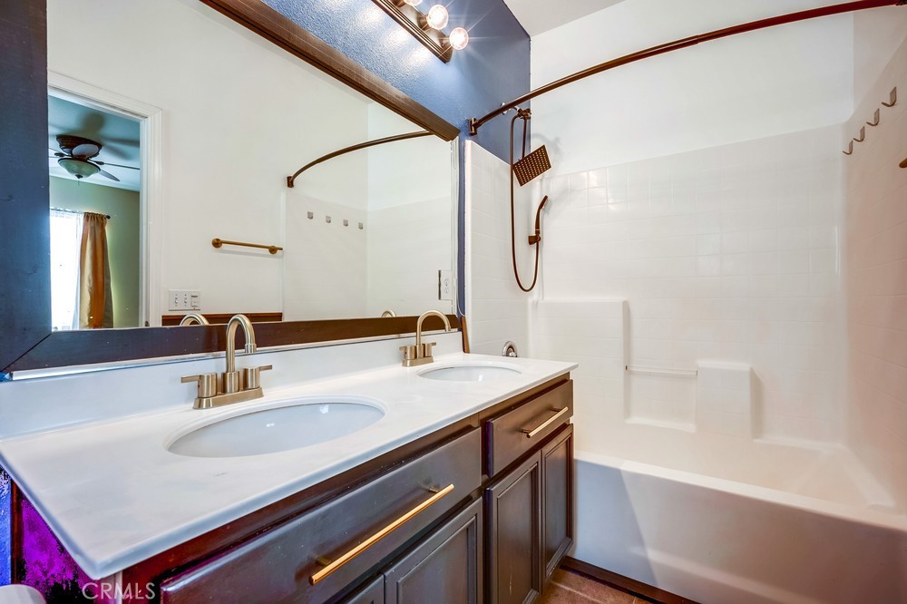 33409 Mesolite Way Menifee, CA 92584 - Photo 9 of 18 a bathroom with a sink and a mirror