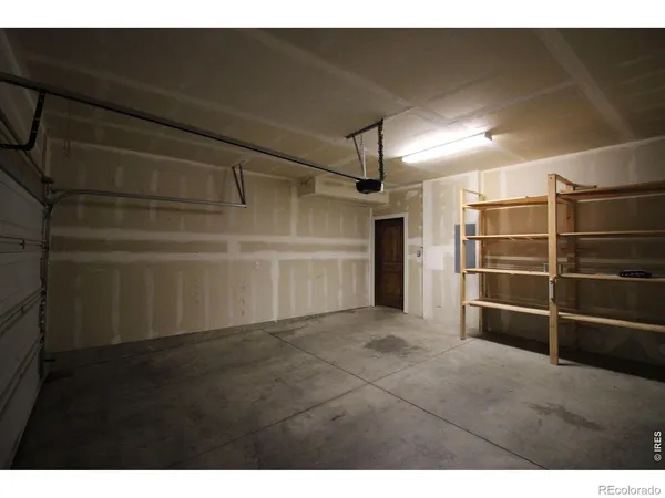 a view of an empty room with a fireplace