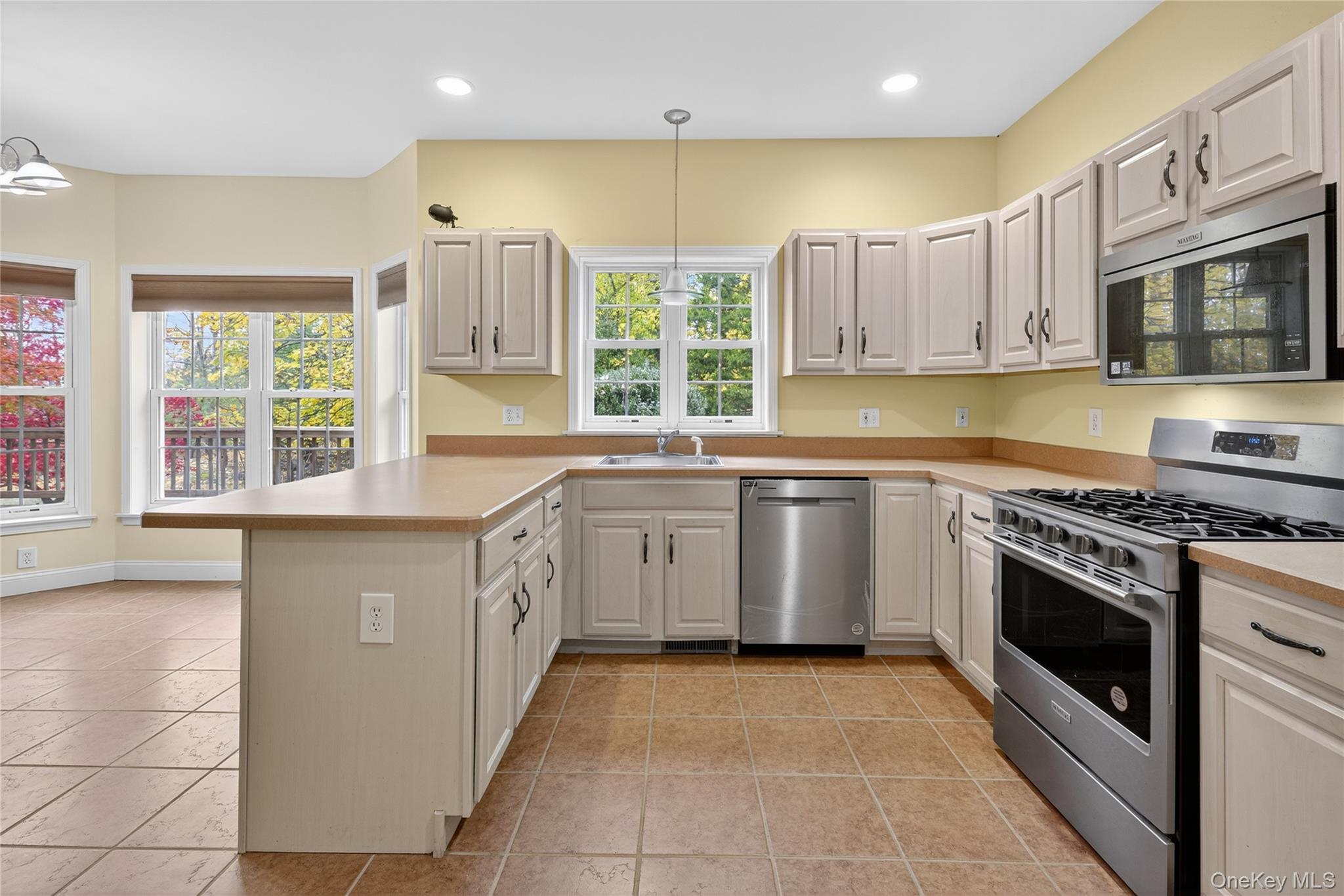 9 Exeter Circle Beacon, NY 12508 - Photo 13 of 41 a kitchen with a sink stove top oven and refrigerator