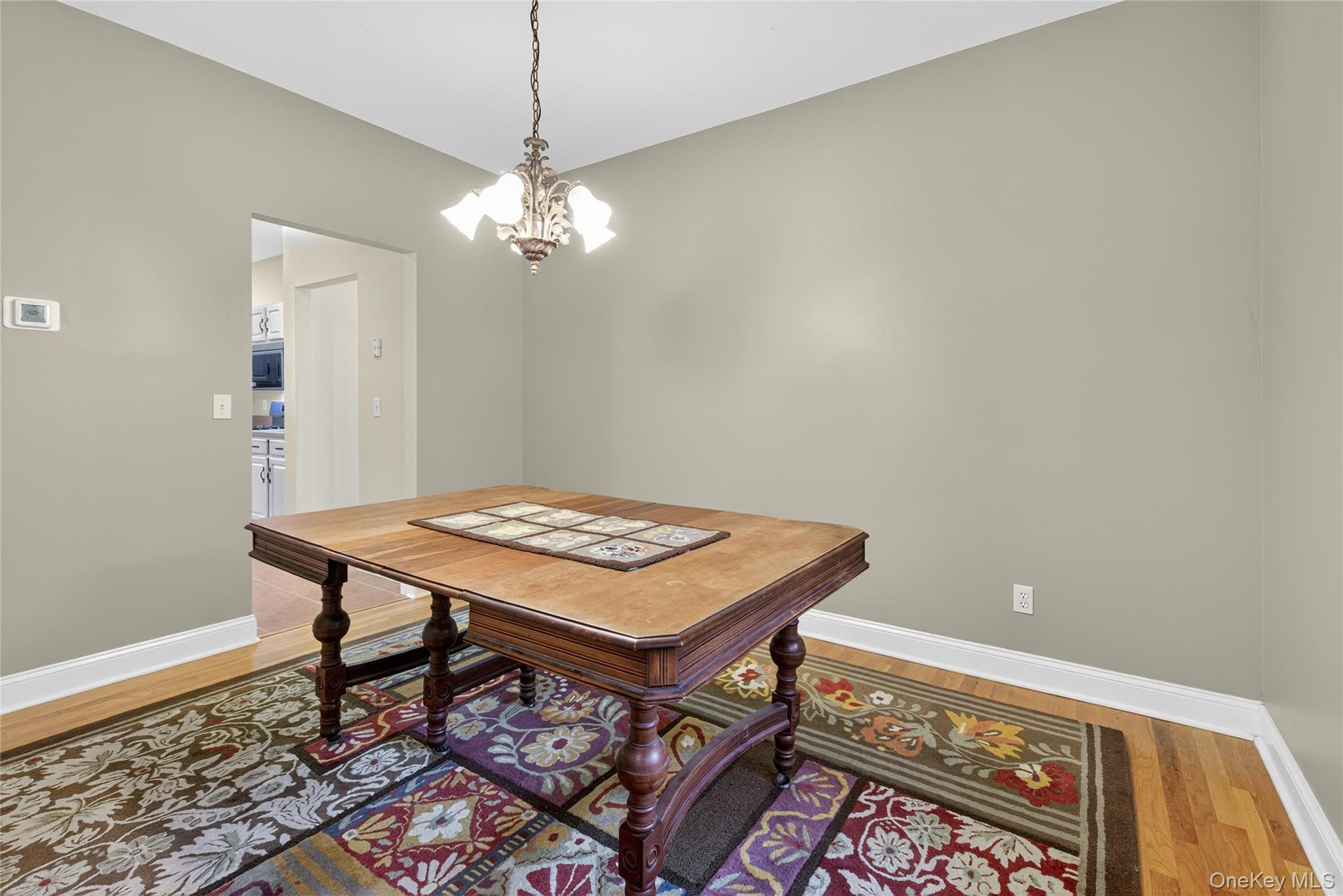 9 Exeter Circle Beacon, NY 12508 - Photo 16 of 41 a view of a room that has a table and a chandelier