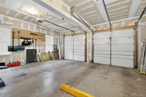 a view of backyard with outdoor seating and plants