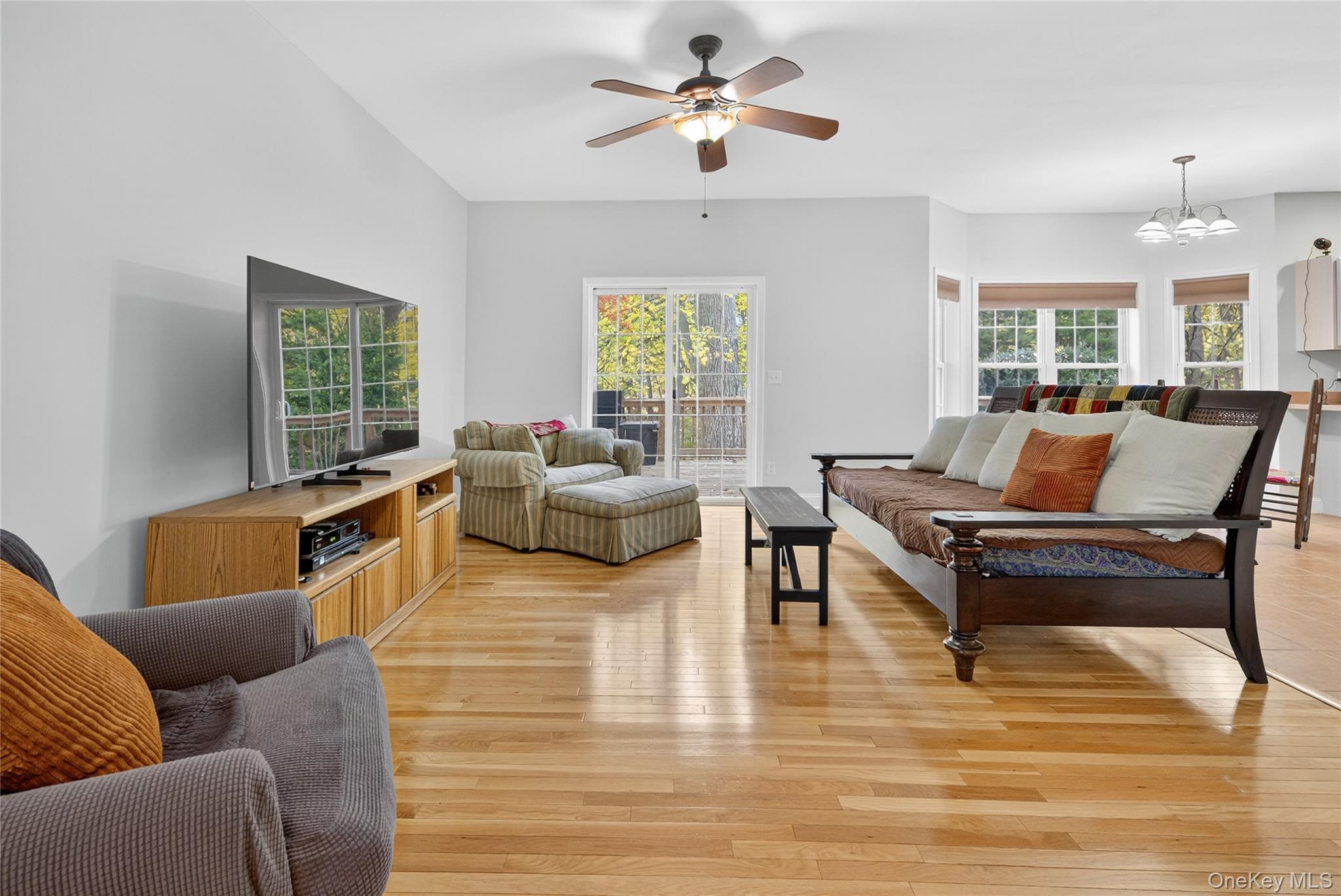 9 Exeter Circle Beacon, NY 12508 - Photo 10 of 41 a living room with furniture ceiling fan and a window