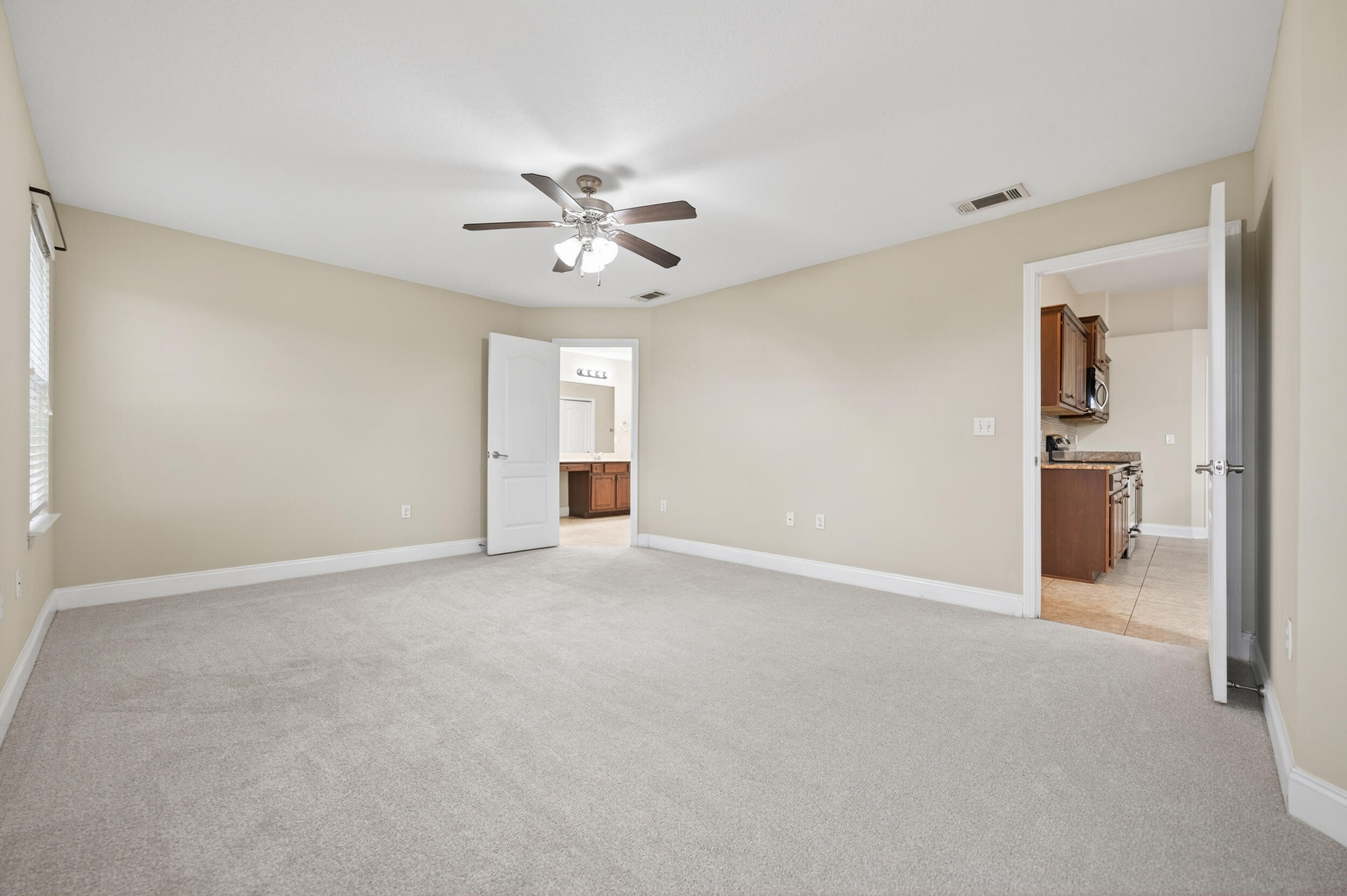 6210 Lapis Lane Crestview, FL 32539 - Photo 31 of 72 a view of an empty room with a ceiling fan