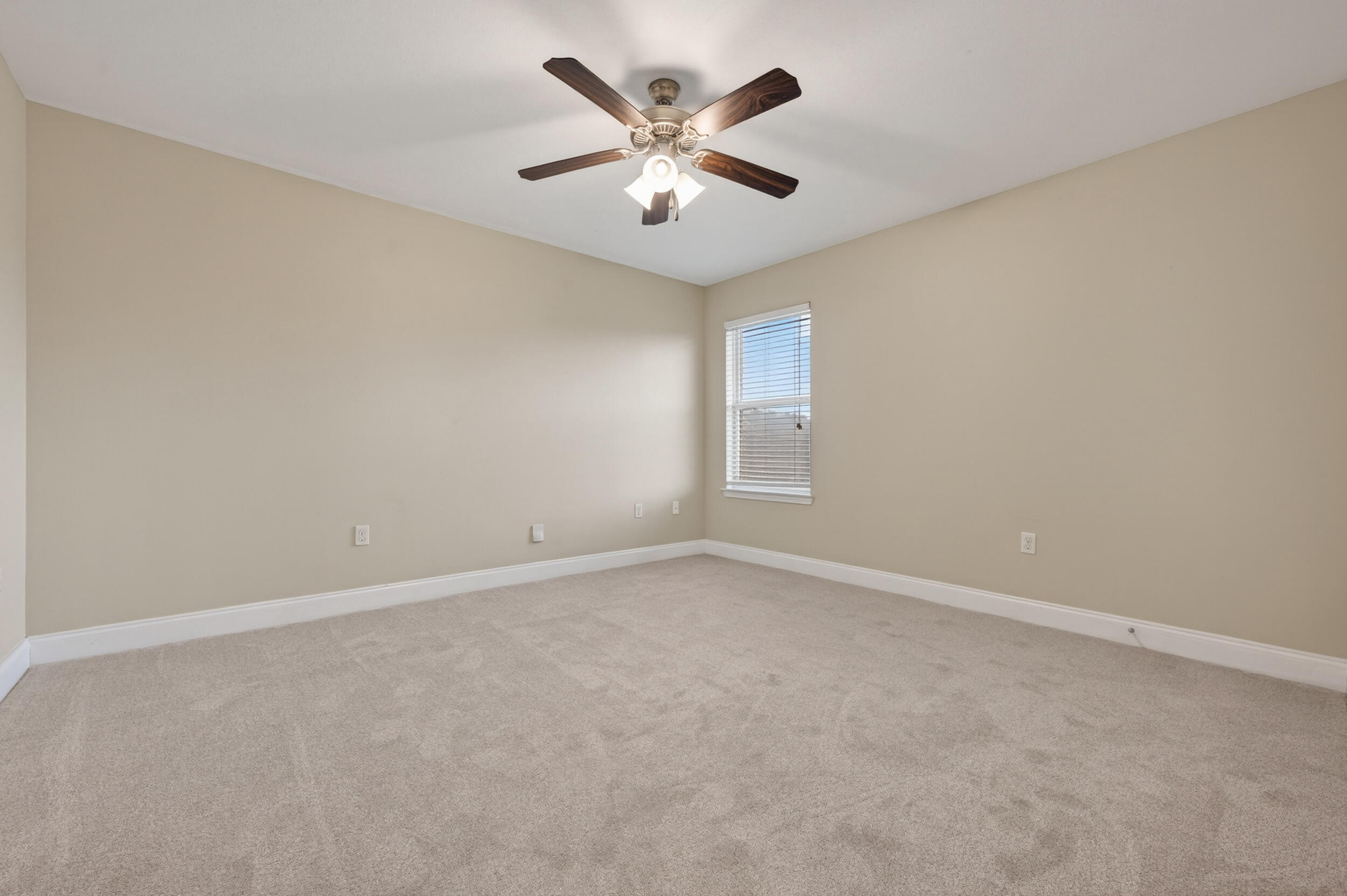 6210 Lapis Lane Crestview, FL 32539 - Photo 45 of 72 an empty room with windows and ceiling fan