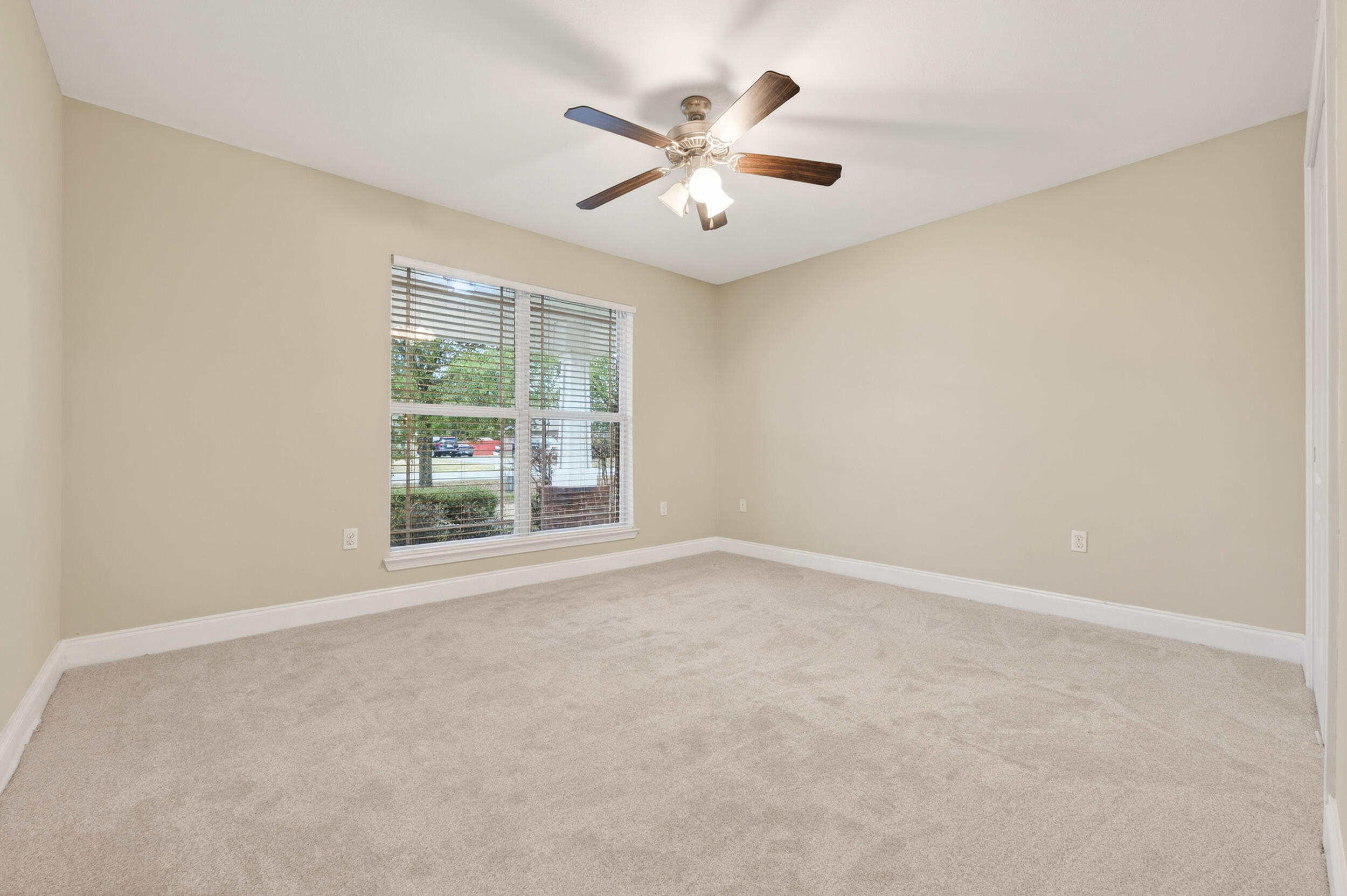 6210 Lapis Lane Crestview, FL 32539 - Photo 49 of 72 an empty room with window and ceiling fan
