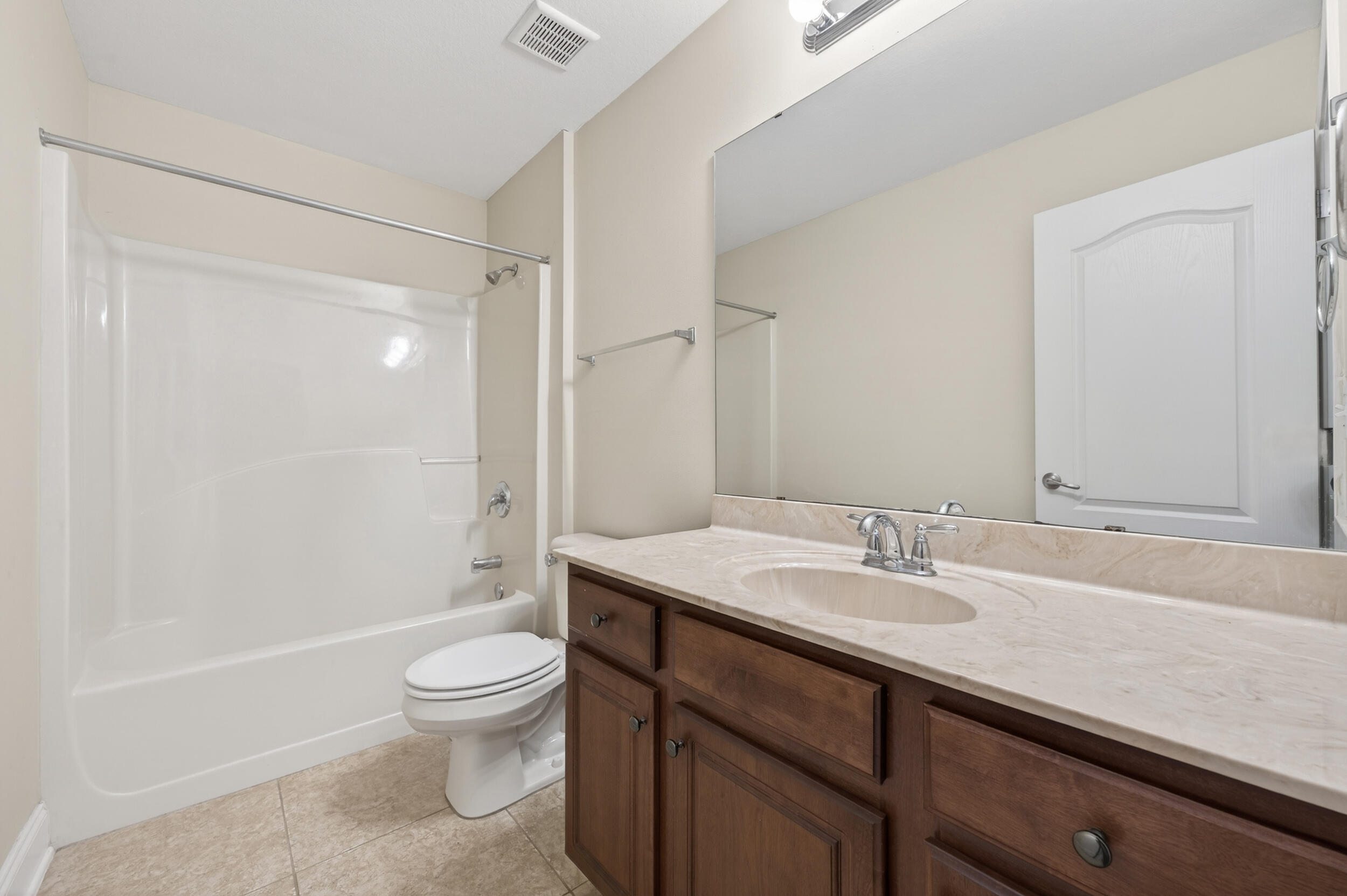 6210 Lapis Lane Crestview, FL 32539 - Photo 51 of 72 a bathroom with a sink a toilet and shower