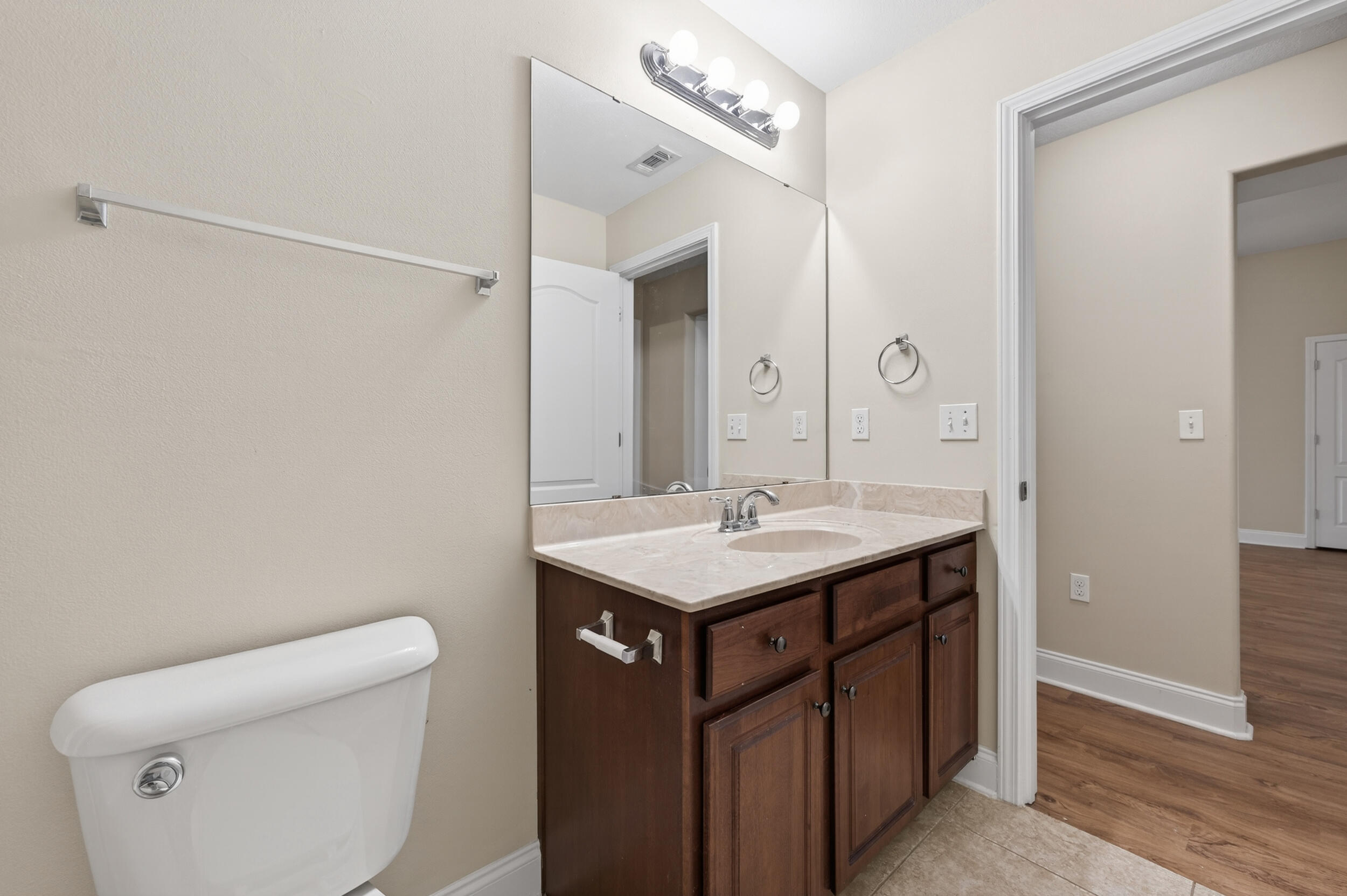 6210 Lapis Lane Crestview, FL 32539 - Photo 52 of 72 a bathroom with a sink toilet and a mirror