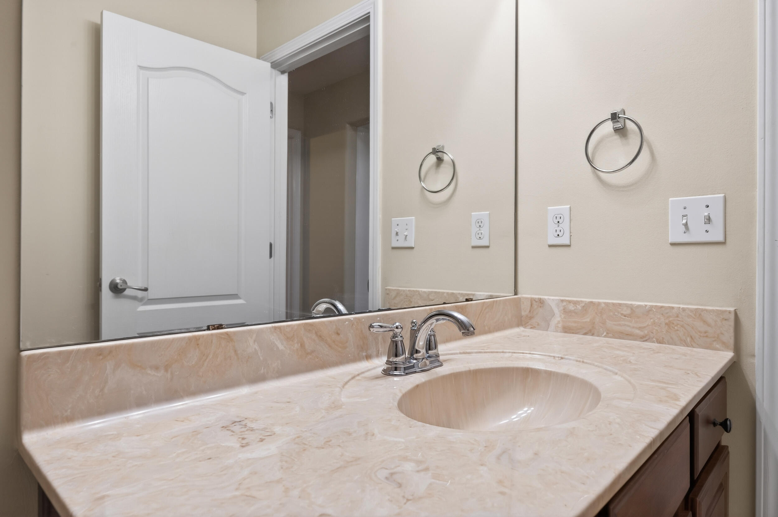 6210 Lapis Lane Crestview, FL 32539 - Photo 53 of 72 a bathroom with a granite countertop sink and a mirror