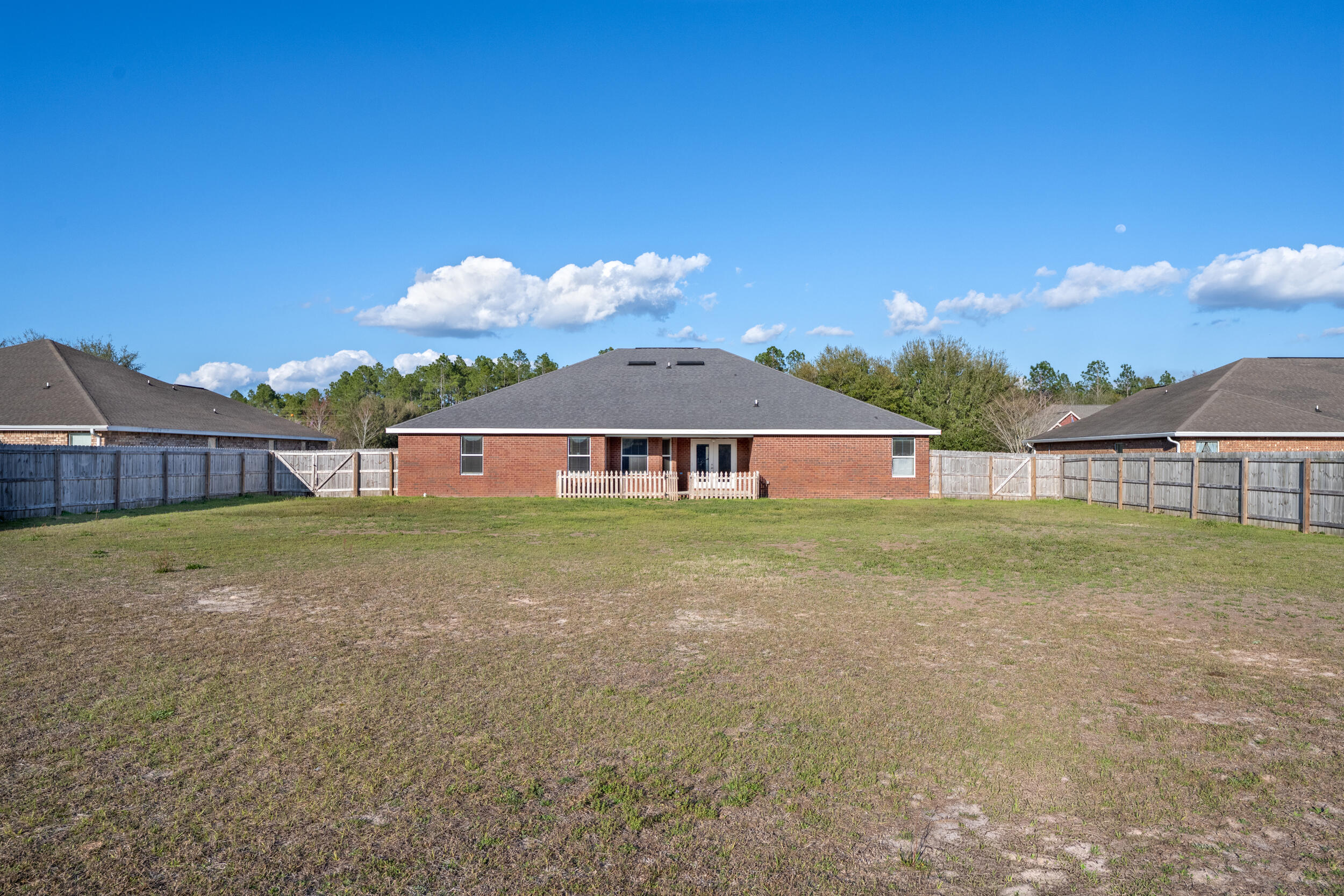 6210 Lapis Lane Crestview, FL 32539 - Photo 61 of 72 a front view of a house with garden