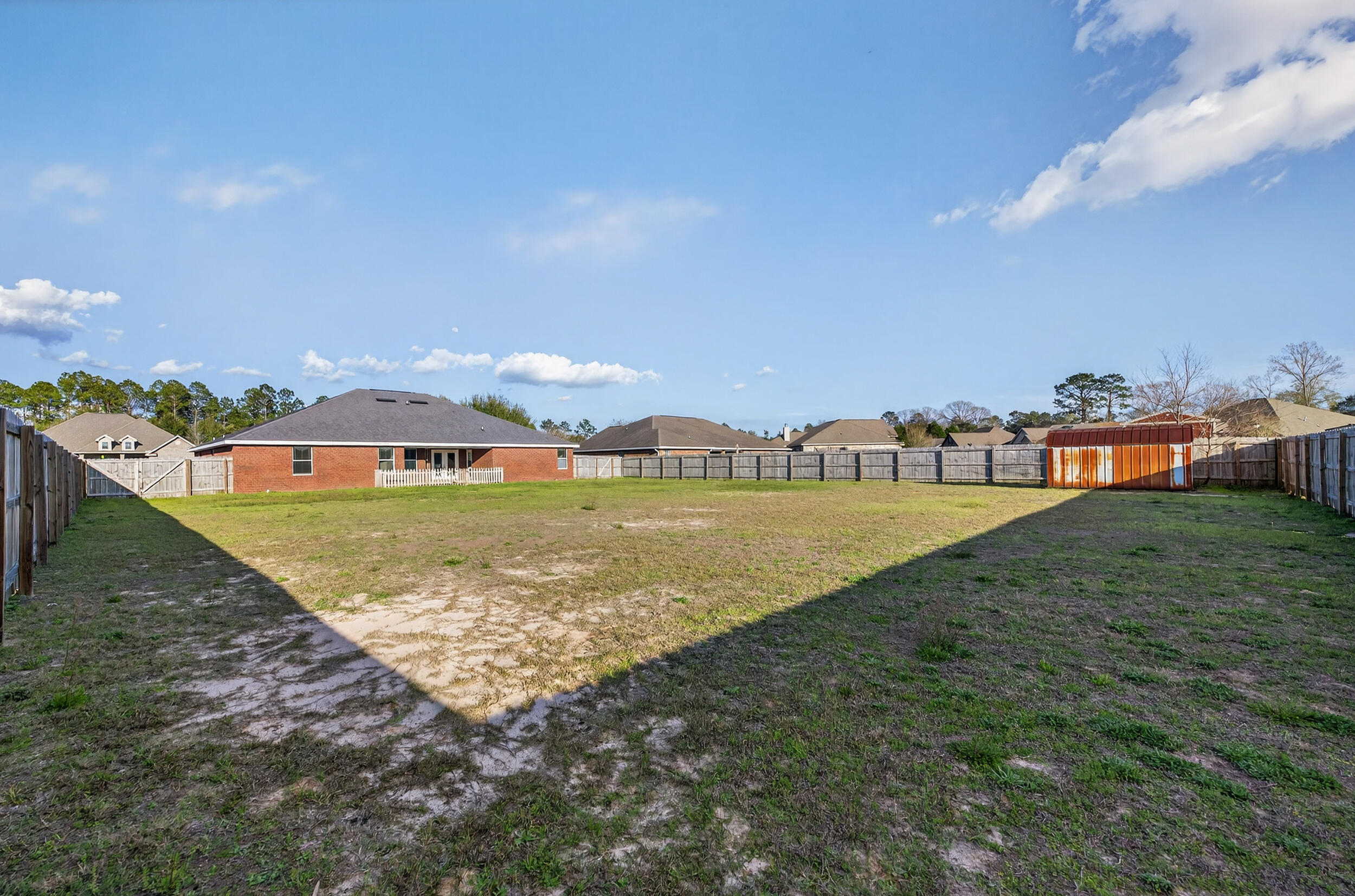6210 Lapis Lane Crestview, FL 32539 - Photo 64 of 72 a view of a house with a yard and lake view