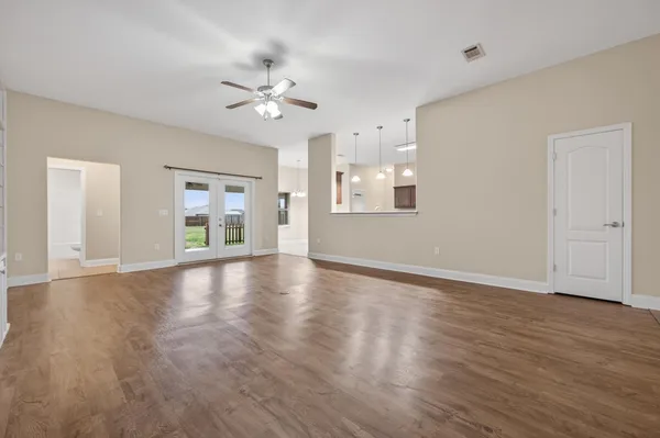 a large kitchen with stainless steel appliances and cabinets