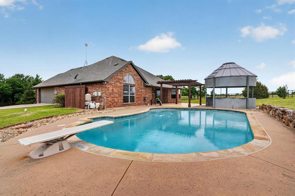 2828 Bennett Road Howe, TX 75459 - Photo 33 of 39 a view of a house with swimming pool and sitting area