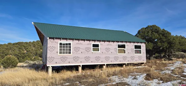 a front view of a house with a lake view
