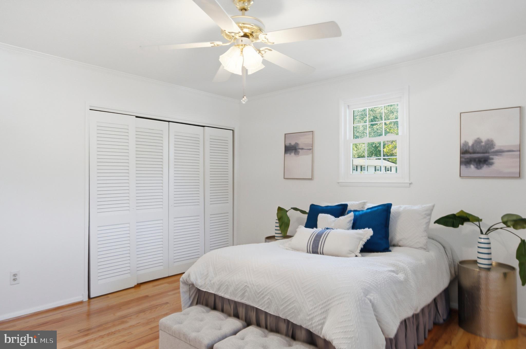 220 Solway Road Lutherville-Timonium, MD 21093 - Photo 12 of 38 a bedroom with a bed and a chandelier