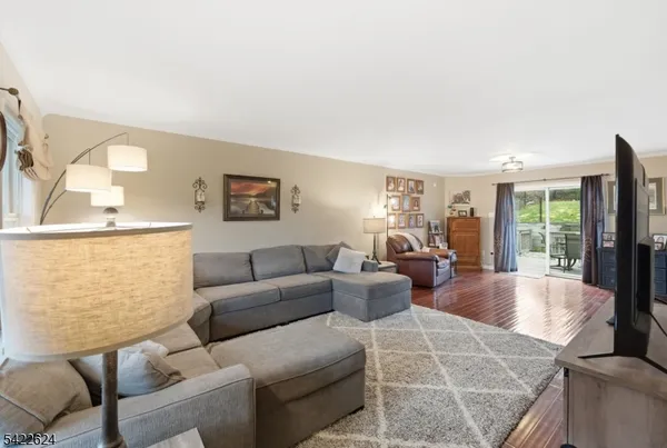 a bathroom with a toilet sink vanity and mirror