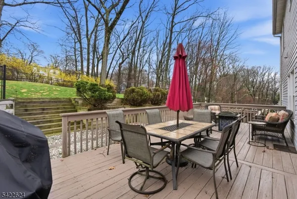 a view of a patio with couches table and chairs and potted plants