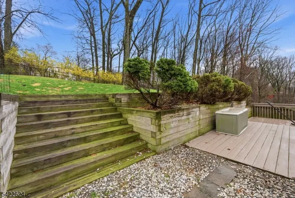 a view of a wooden deck with a yard