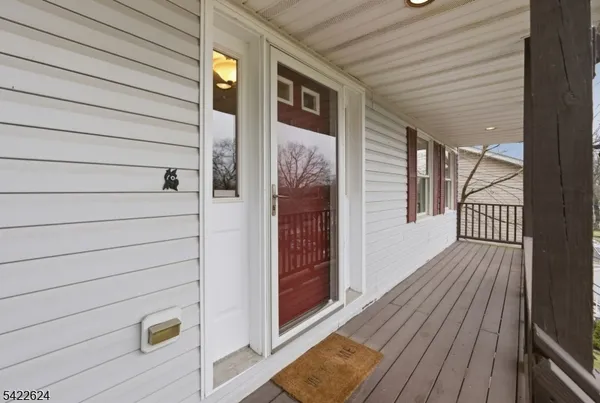 a view of a livingroom with workspace and a window