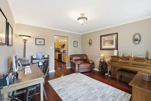a workspace with furniture window and wooden floor