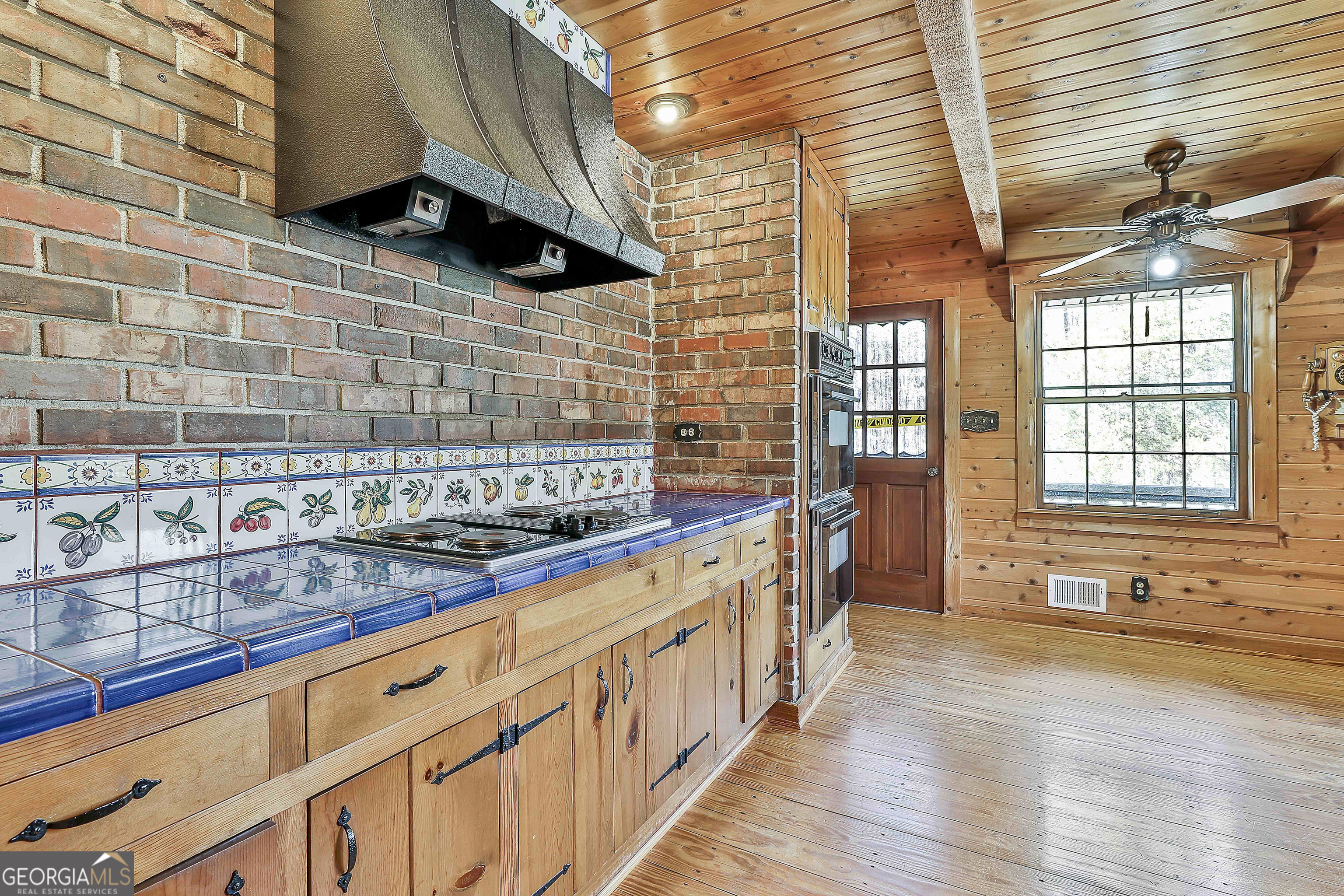 161 Mockingbird Lane Brooks, GA 30205 - Photo 20 of 57 a kitchen with stainless steel appliances granite countertop a sink and a stove