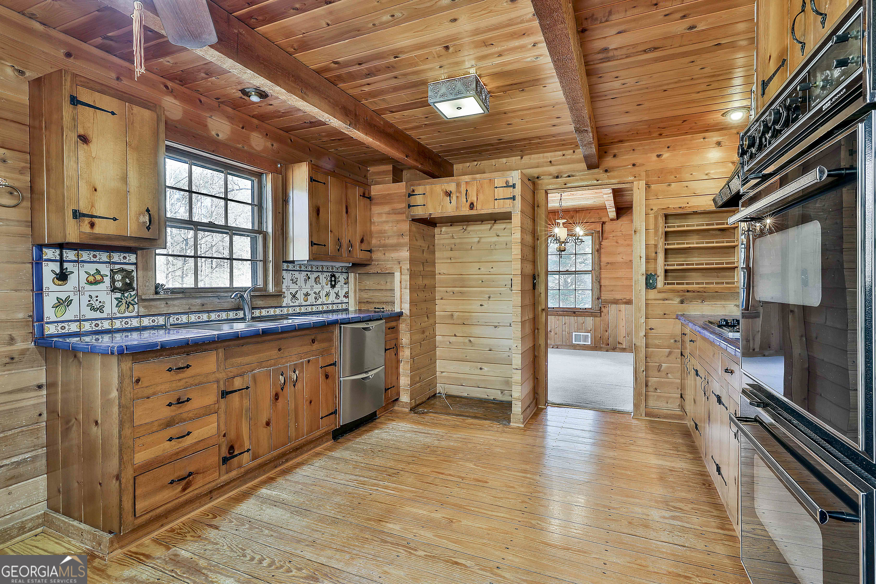 161 Mockingbird Lane Brooks, GA 30205 - Photo 23 of 57 a kitchen with stainless steel appliances granite countertop a stove a sink and a refrigerator
