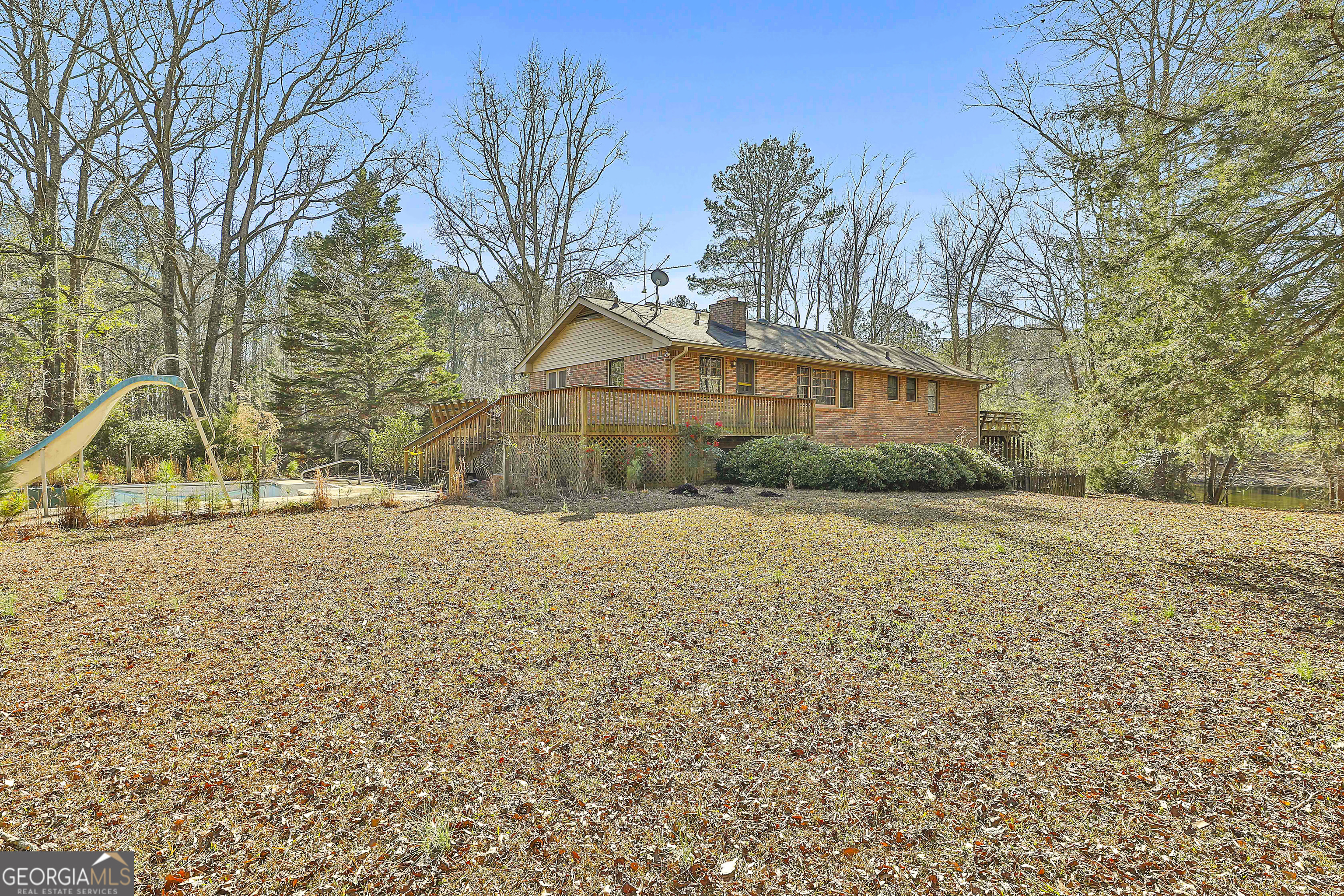 161 Mockingbird Lane Brooks, GA 30205 - Photo 50 of 57 a house that has a tree in front of it