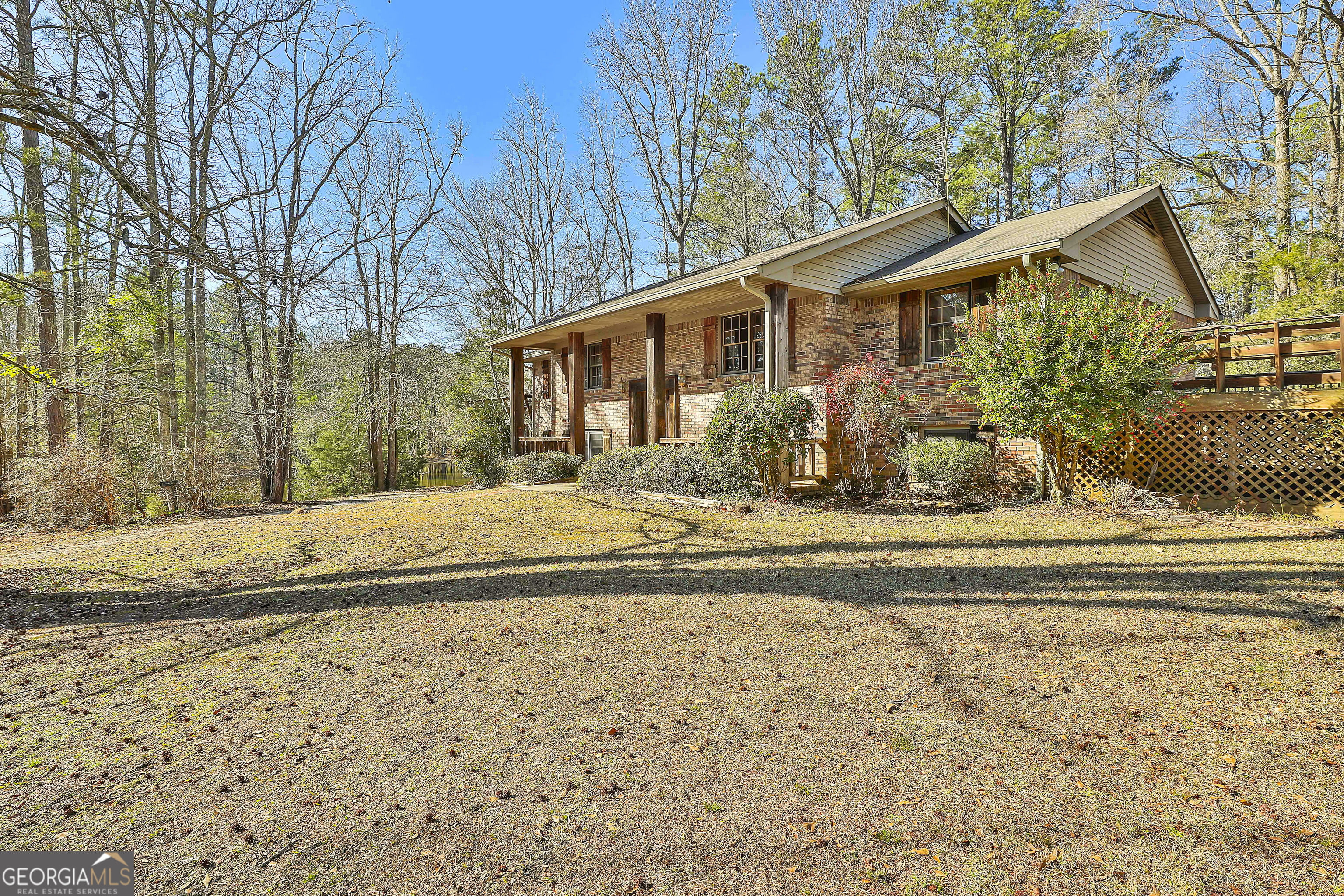 161 Mockingbird Lane Brooks, GA 30205 - Photo 7 of 57 a front view of a house with a yard