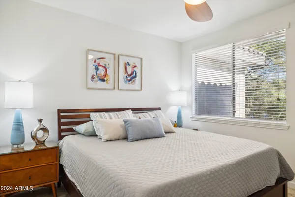 a bedroom with a bed and window