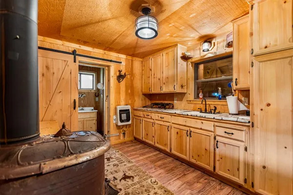 a view of a chair and tables in the backyard of the house