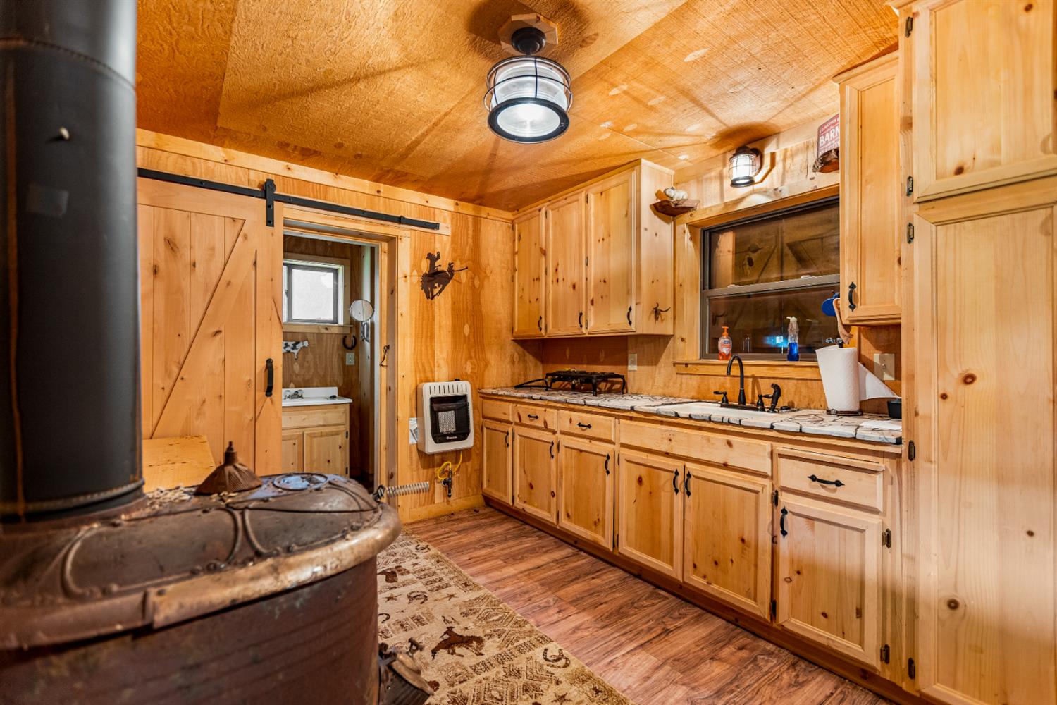 0 Skunk Gulch Road Murphys, CA 95247 - Photo 16 of 67 a kitchen with stainless steel appliances granite countertop a sink and cabinets