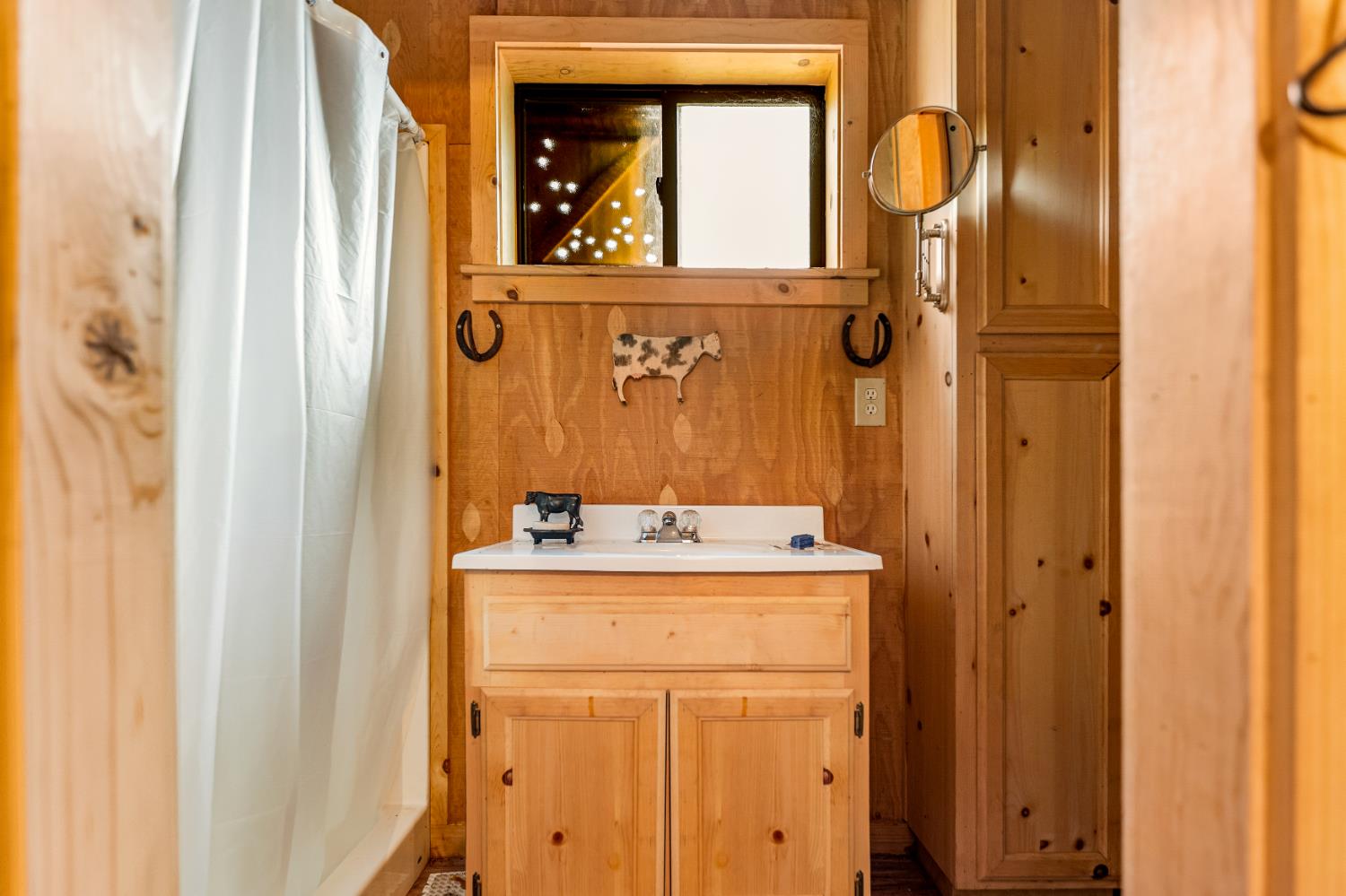 0 Skunk Gulch Road Murphys, CA 95247 - Photo 17 of 67 a bathroom with a granite countertop sink a mirror and shower