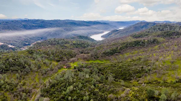 a view of a swimming pool with a backyard