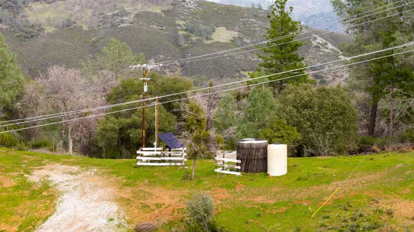a view of a mountain range with lush green forest