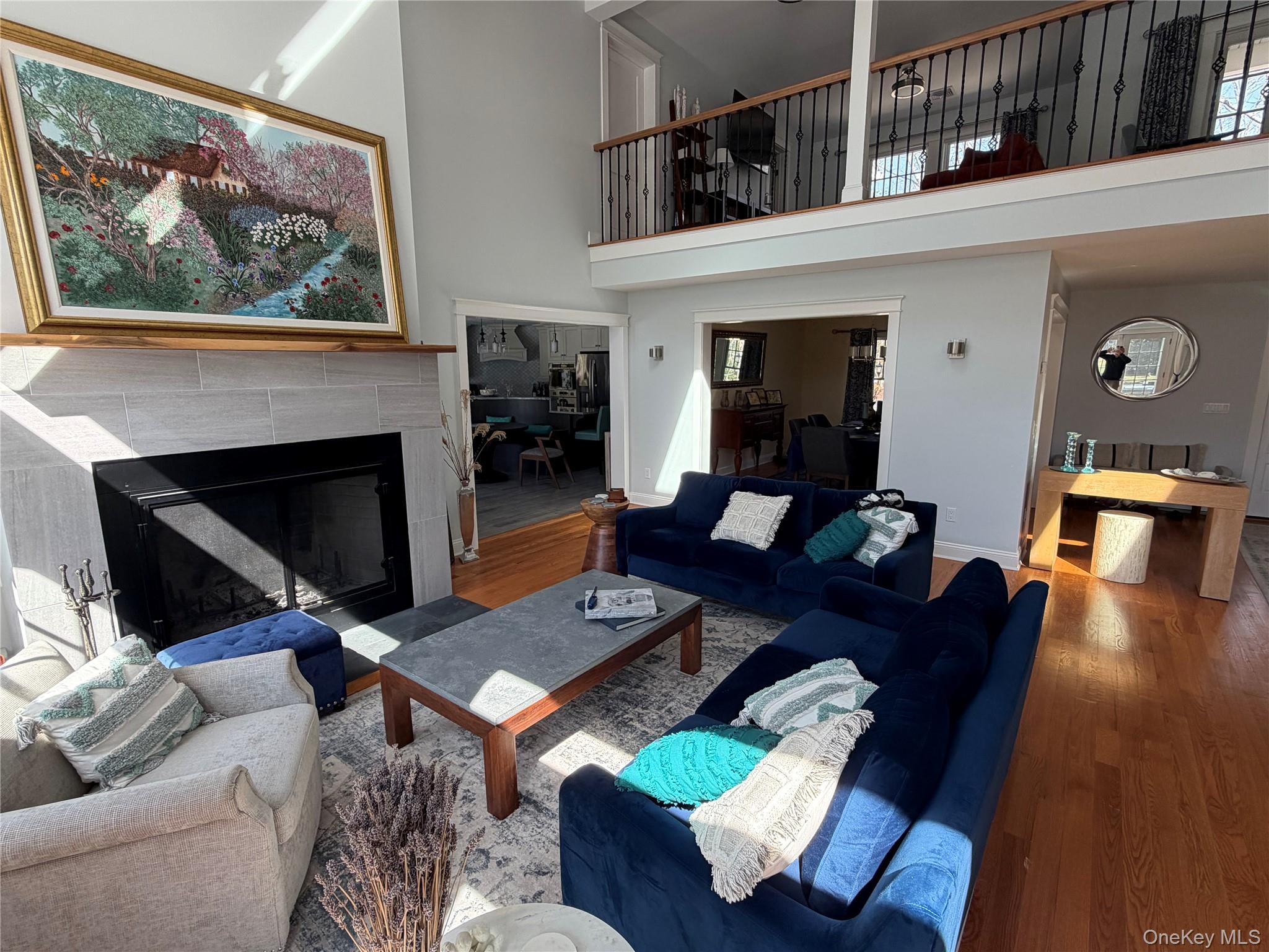 27 Deer Path Quogue, NY 11959 - Photo 11 of 44 a living room with furniture and a fireplace