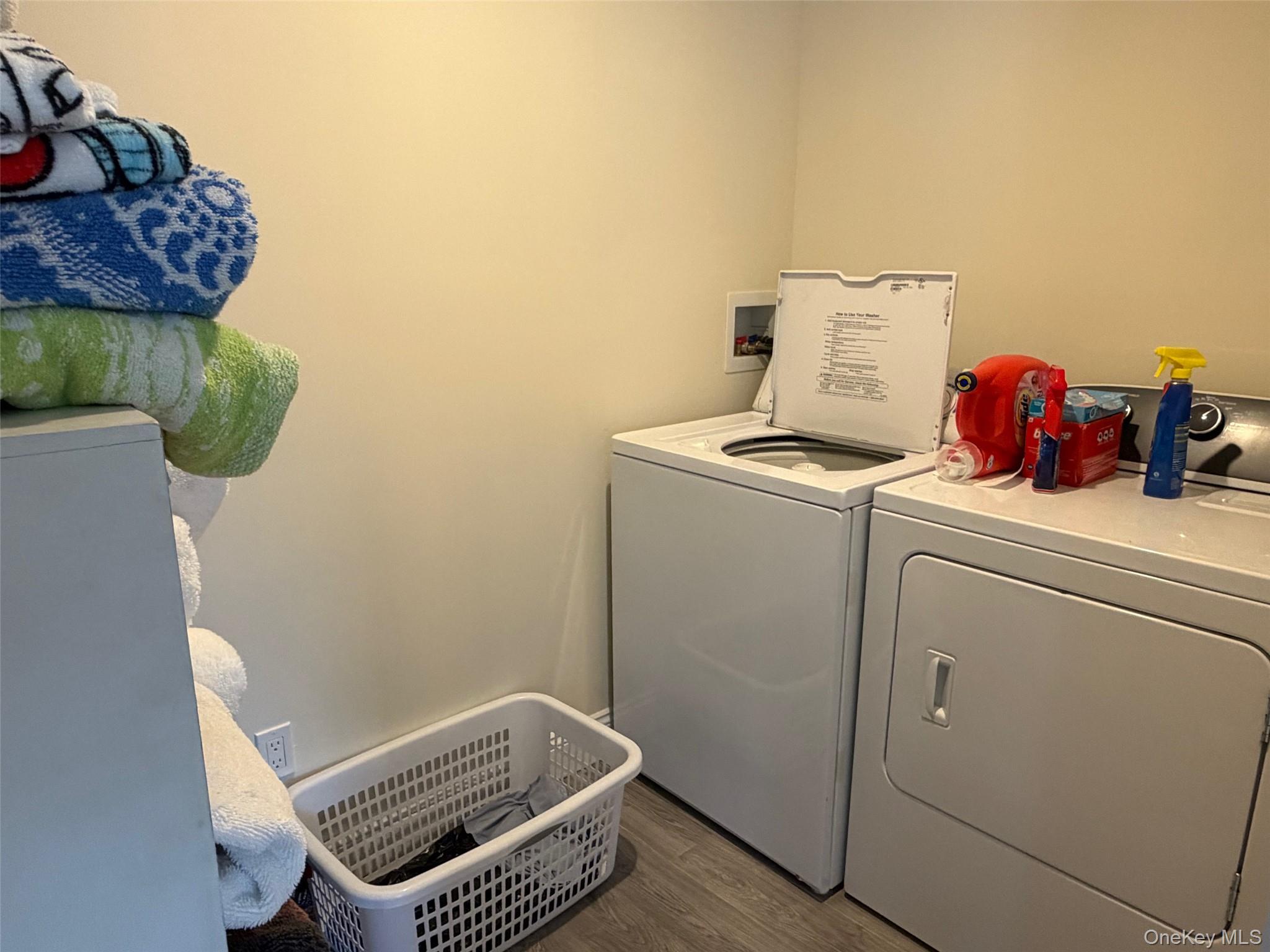27 Deer Path Quogue, NY 11959 - Photo 18 of 44 a utility room with dryer and washer