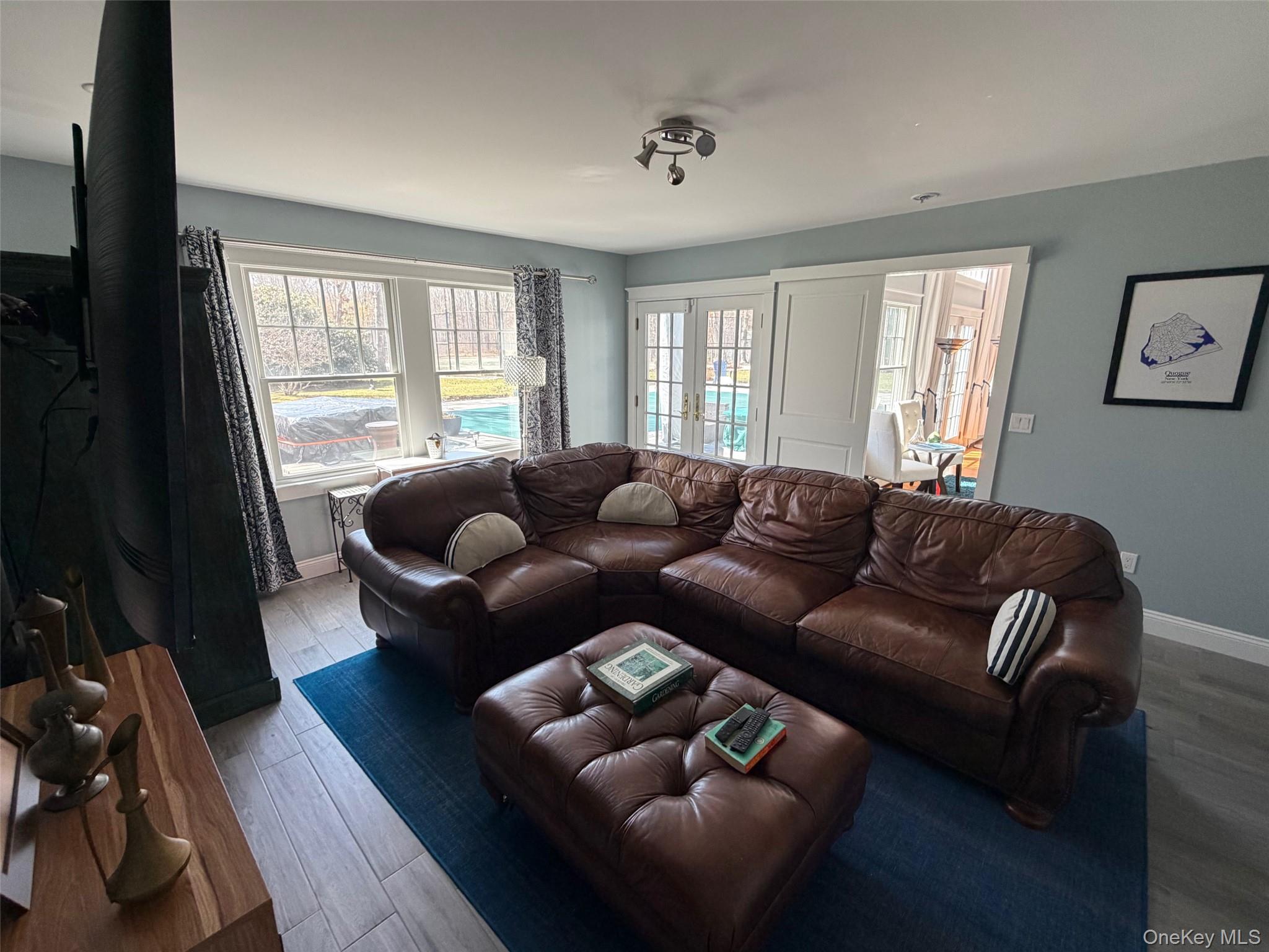 27 Deer Path Quogue, NY 11959 - Photo 20 of 44 a living room with furniture and a large window