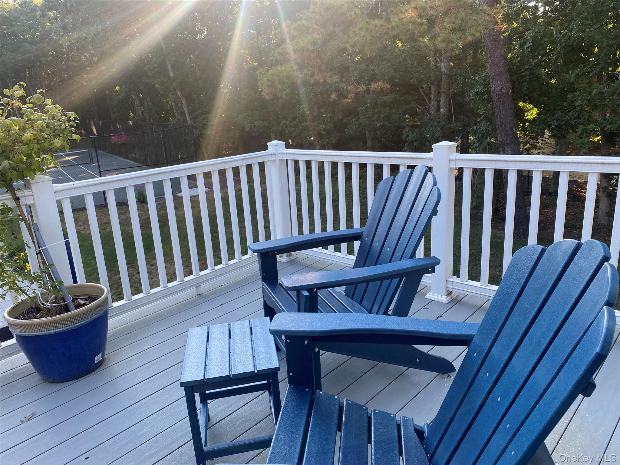 27 Deer Path Quogue, NY 11959 - Photo 2 of 44 a view of a chair in wooden deck