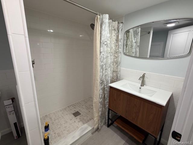 27 Deer Path Quogue, NY 11959 - Photo 26 of 44 a bathroom with a sink toilet a mirror and shower