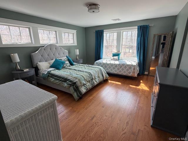 27 Deer Path Quogue, NY 11959 - Photo 28 of 44 a bedroom with two beds and a large window