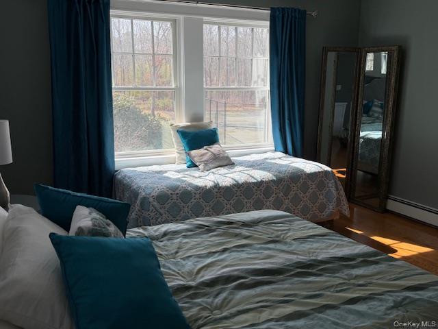 27 Deer Path Quogue, NY 11959 - Photo 29 of 44 a bedroom with a bed and a window