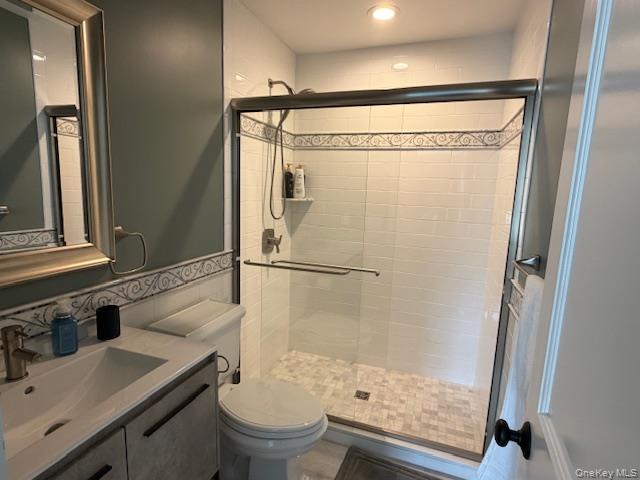 27 Deer Path Quogue, NY 11959 - Photo 30 of 44 a bathroom with a granite countertop sink toilet and shower