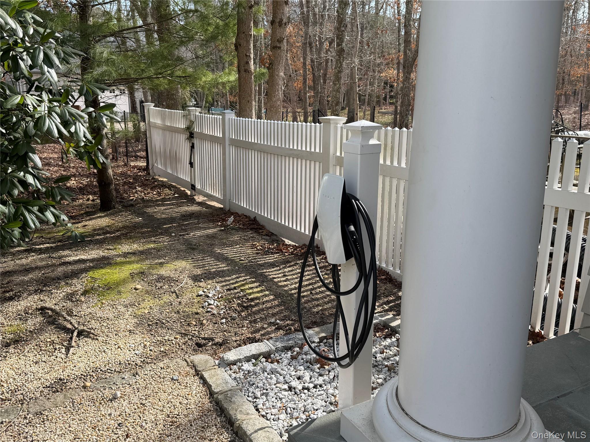 27 Deer Path Quogue, NY 11959 - Photo 35 of 44 a view of a balcony with wooden floor