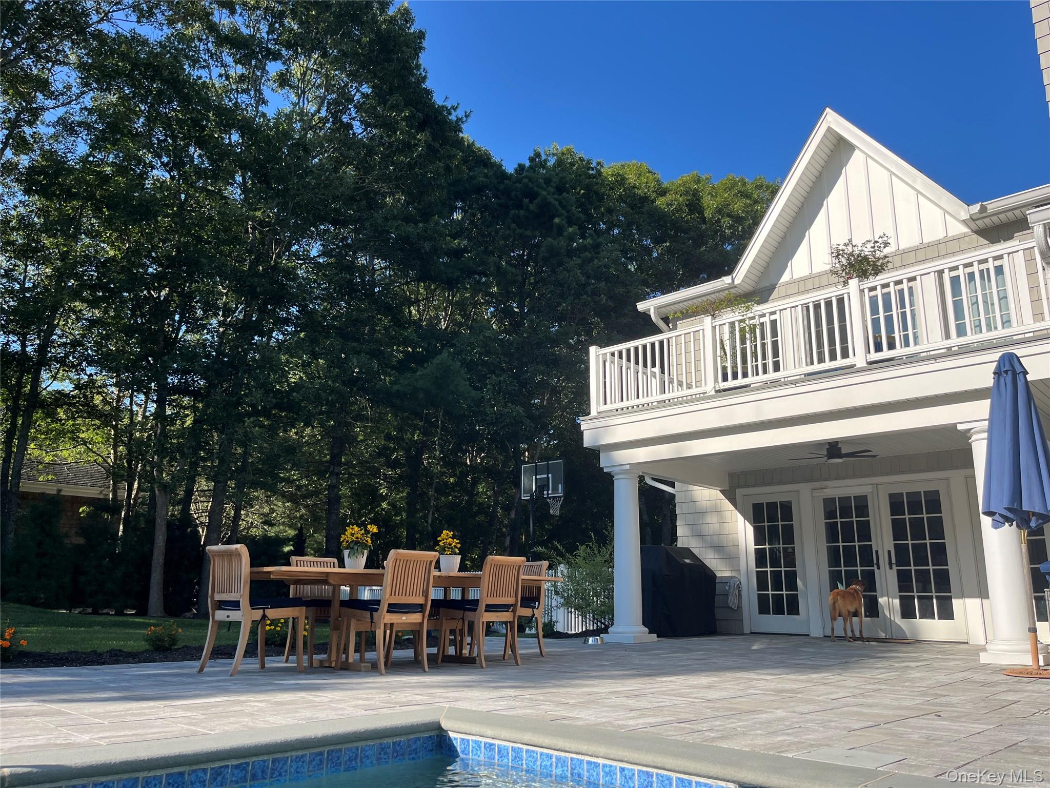 27 Deer Path Quogue, NY 11959 - Photo 44 of 44 a view of a house with sitting area and garden