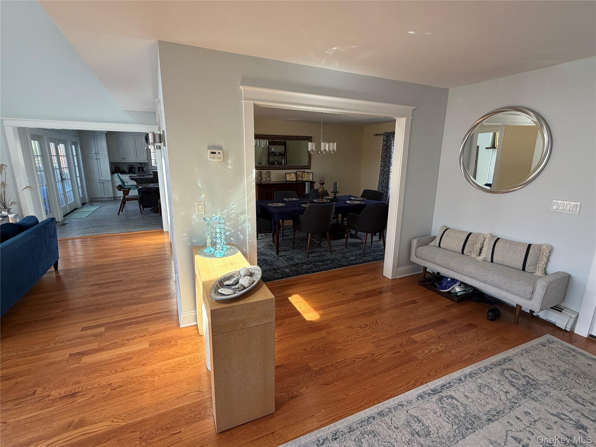 27 Deer Path Quogue, NY 11959 - Photo 8 of 44 a living room with furniture and a wooden floor