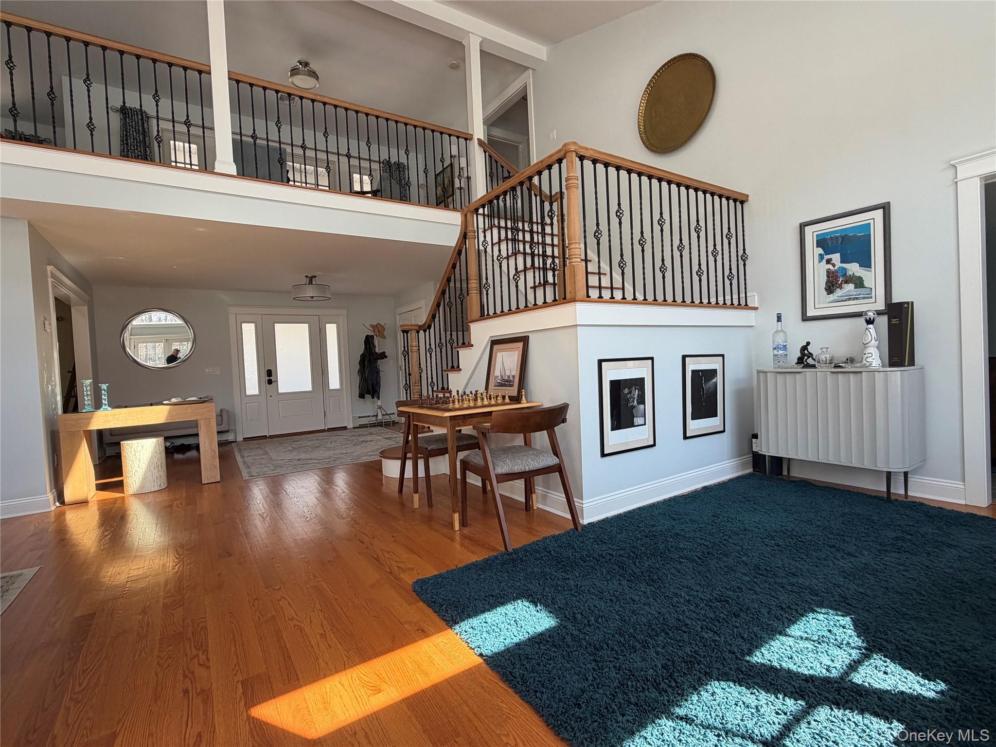 27 Deer Path Quogue, NY 11959 - Photo 9 of 44 a view of a livingroom with furniture and hardwood floor