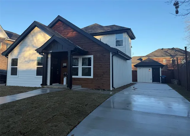 a front view of a house with yard