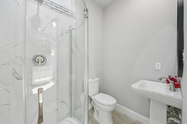 a bathroom with a sink and toilet